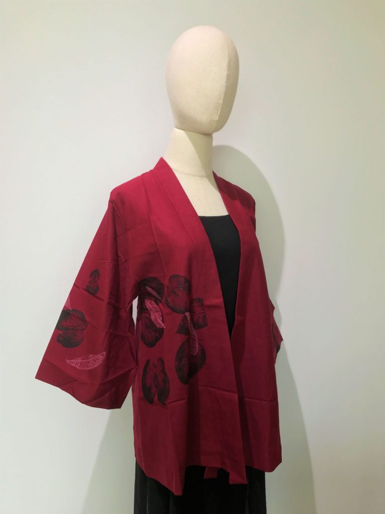 Red Kimono Outer with Black Leaf patterns on a mannequin.
